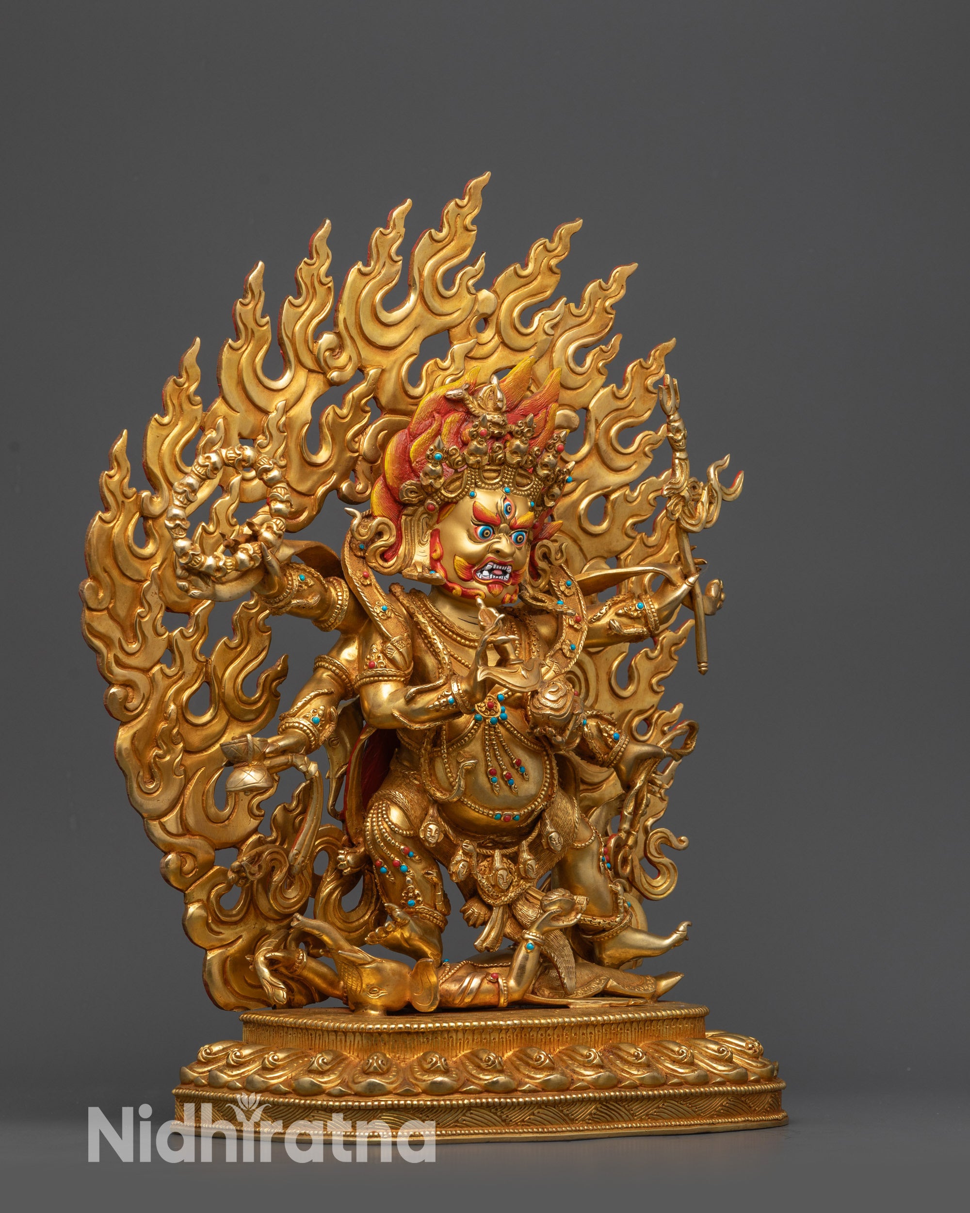 side view Six-Armed Mahakala Statue with tiger-skin robe and skull garland details
