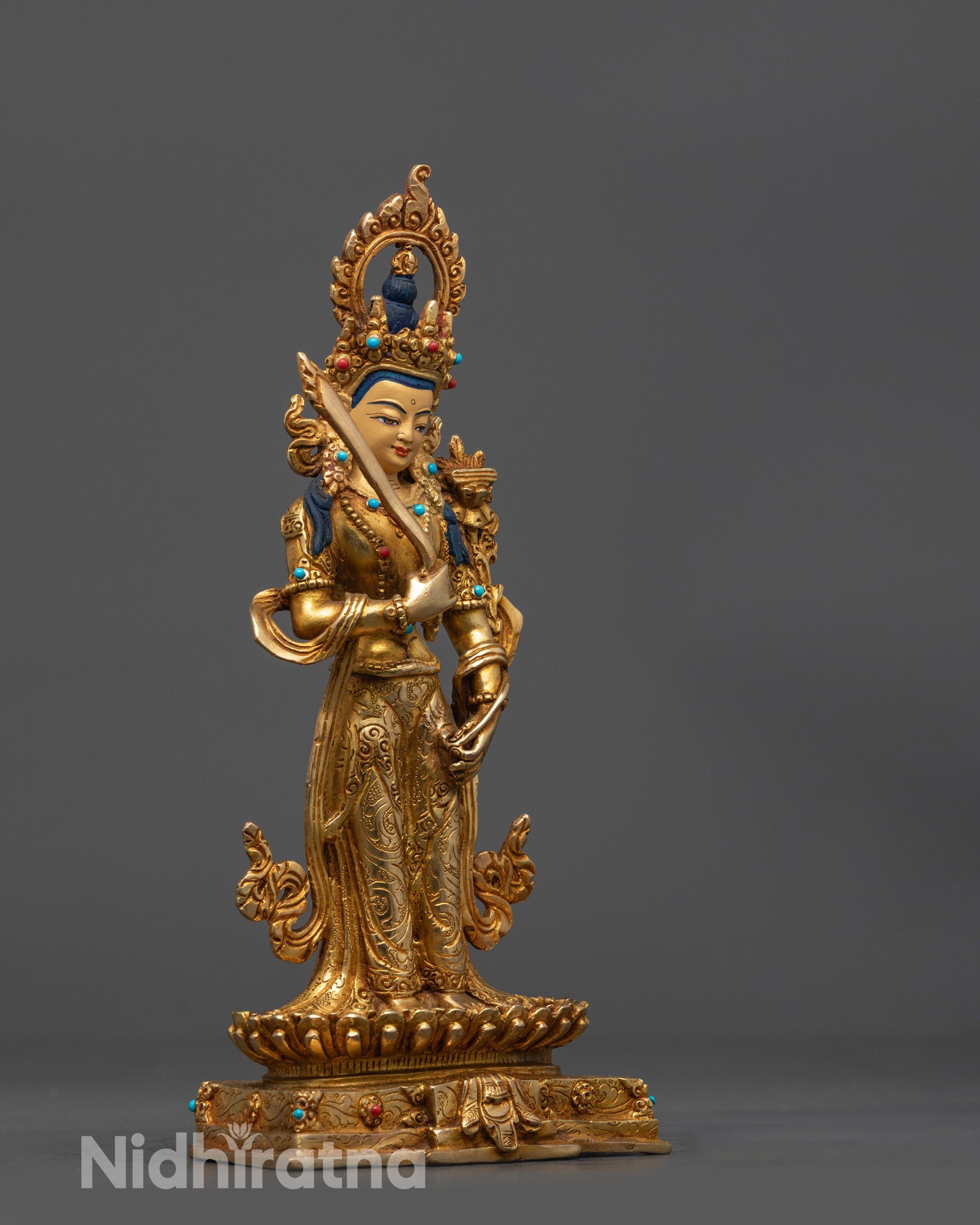 side view Standing Manjushri Statue with golden crown robes and lotus base
