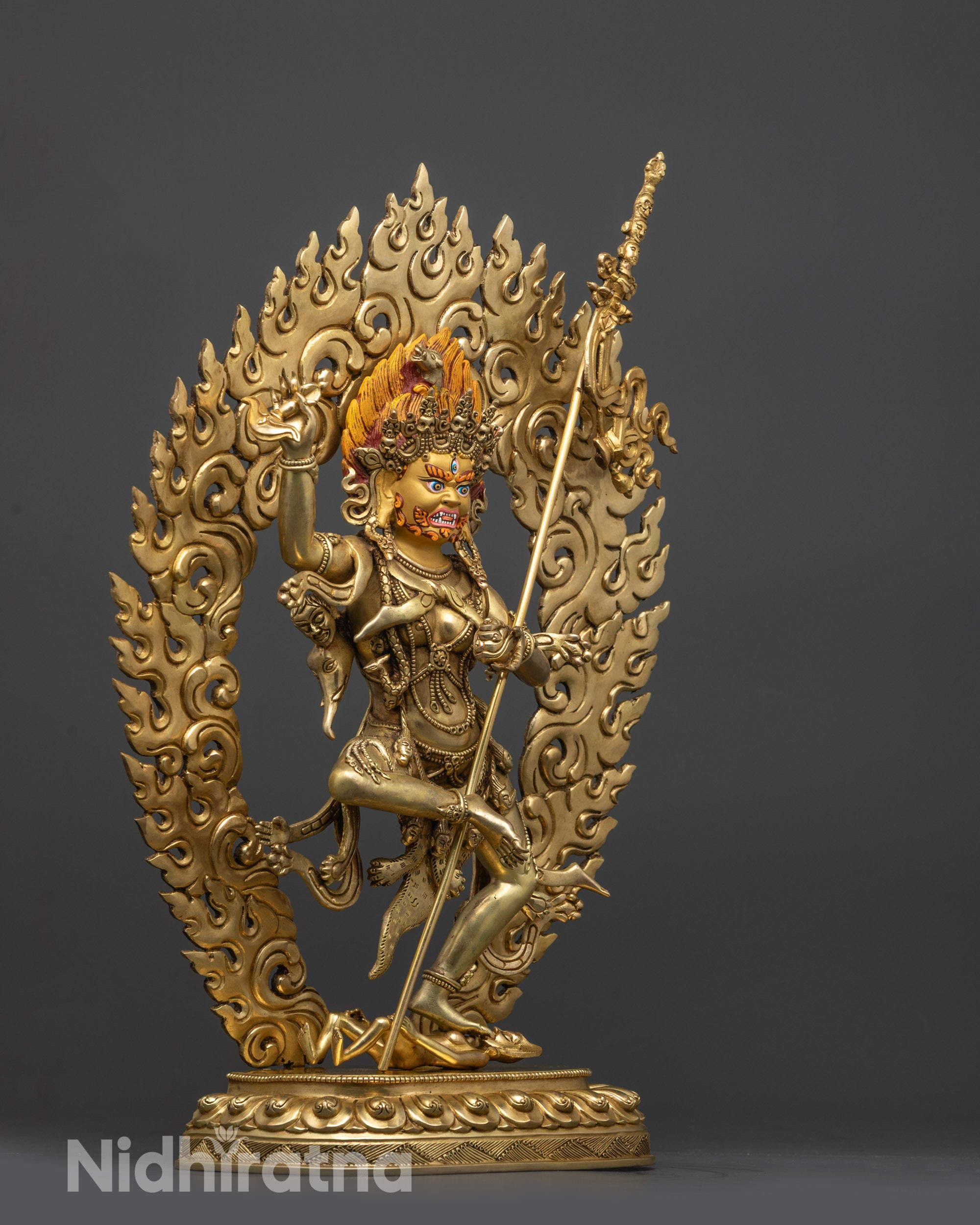 side view Troma Nagmo statue holding kartika knife skull cup and trident
