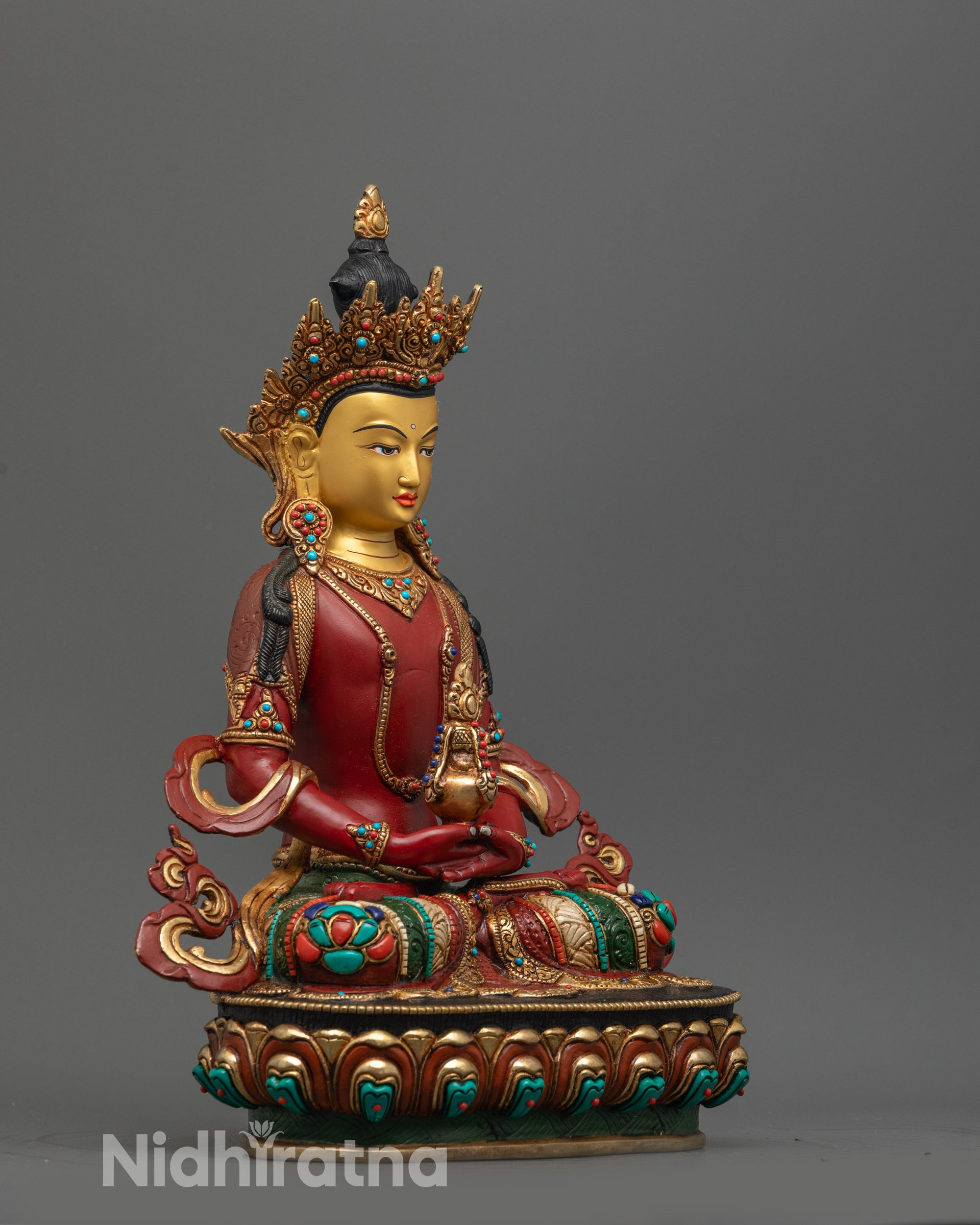 side view of Amitayus statue showing gold-plated robe and intricate carvings