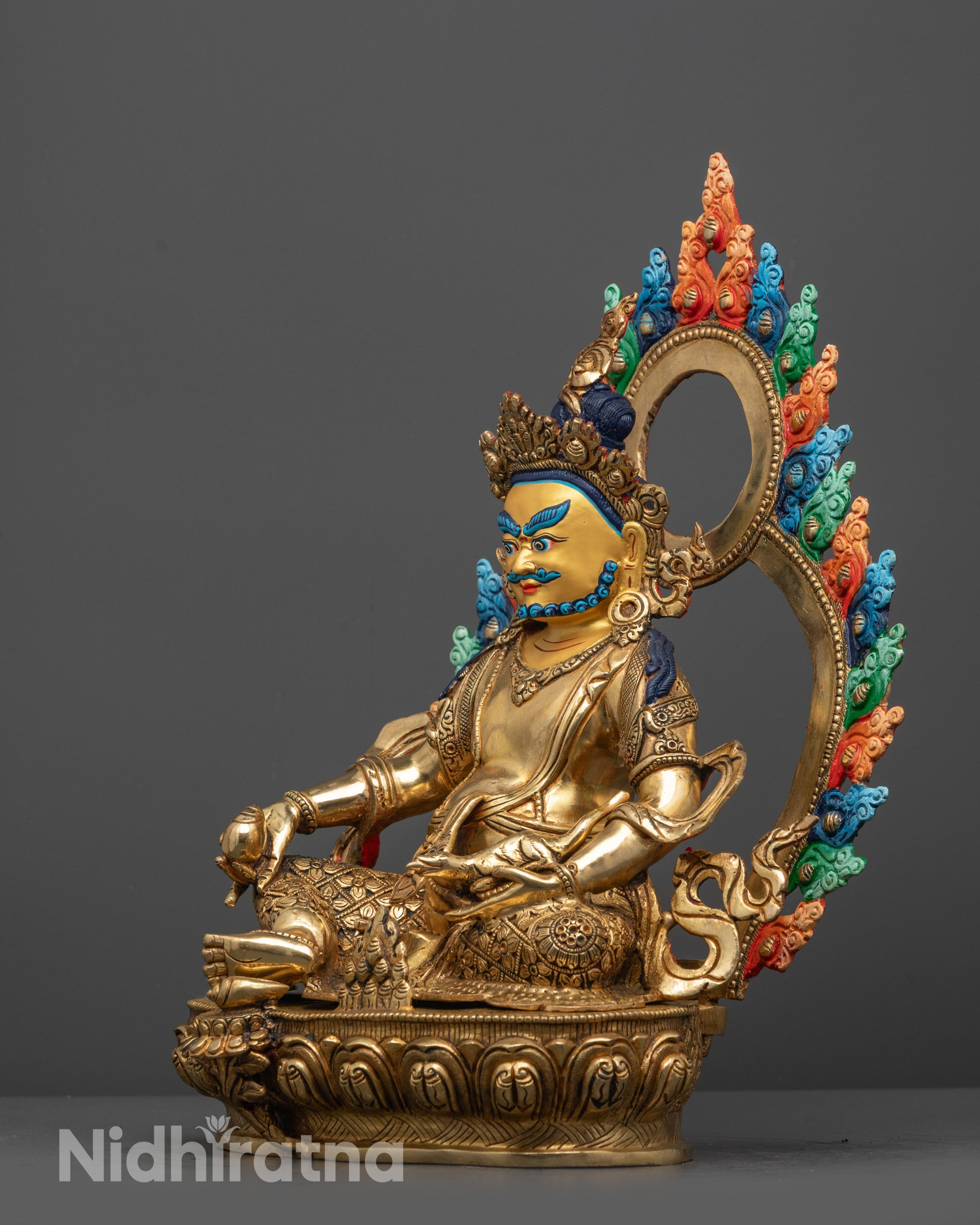 side view of Jambhala Statue with radiant 24k gilding