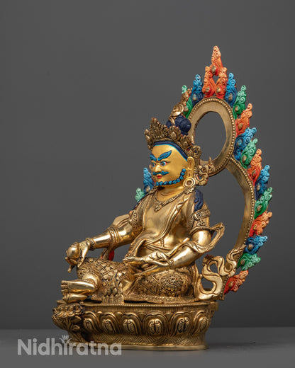 side view of Jambhala Statue with radiant 24k gilding