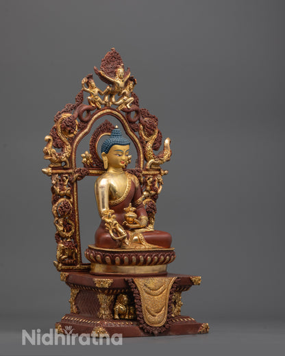 side view of Medicine Buddha statue showing gold-plated lotus seat and detailed copper robe