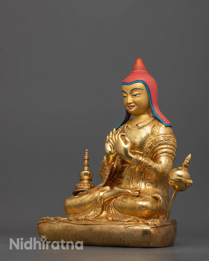 side view of handcrafted Atisa statue with monk’s robe, hat, and surrounding bell and stupa