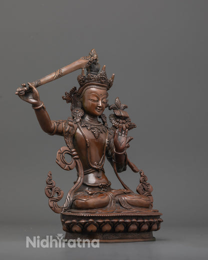 side view of handcrafted Manjushri statue showing sword, utpala flower, and flowing robe