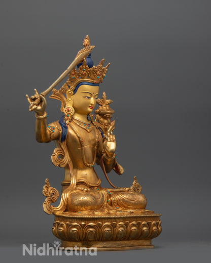 side view of manjushri statue holding sword utpala flower and scripture with intricate carvings