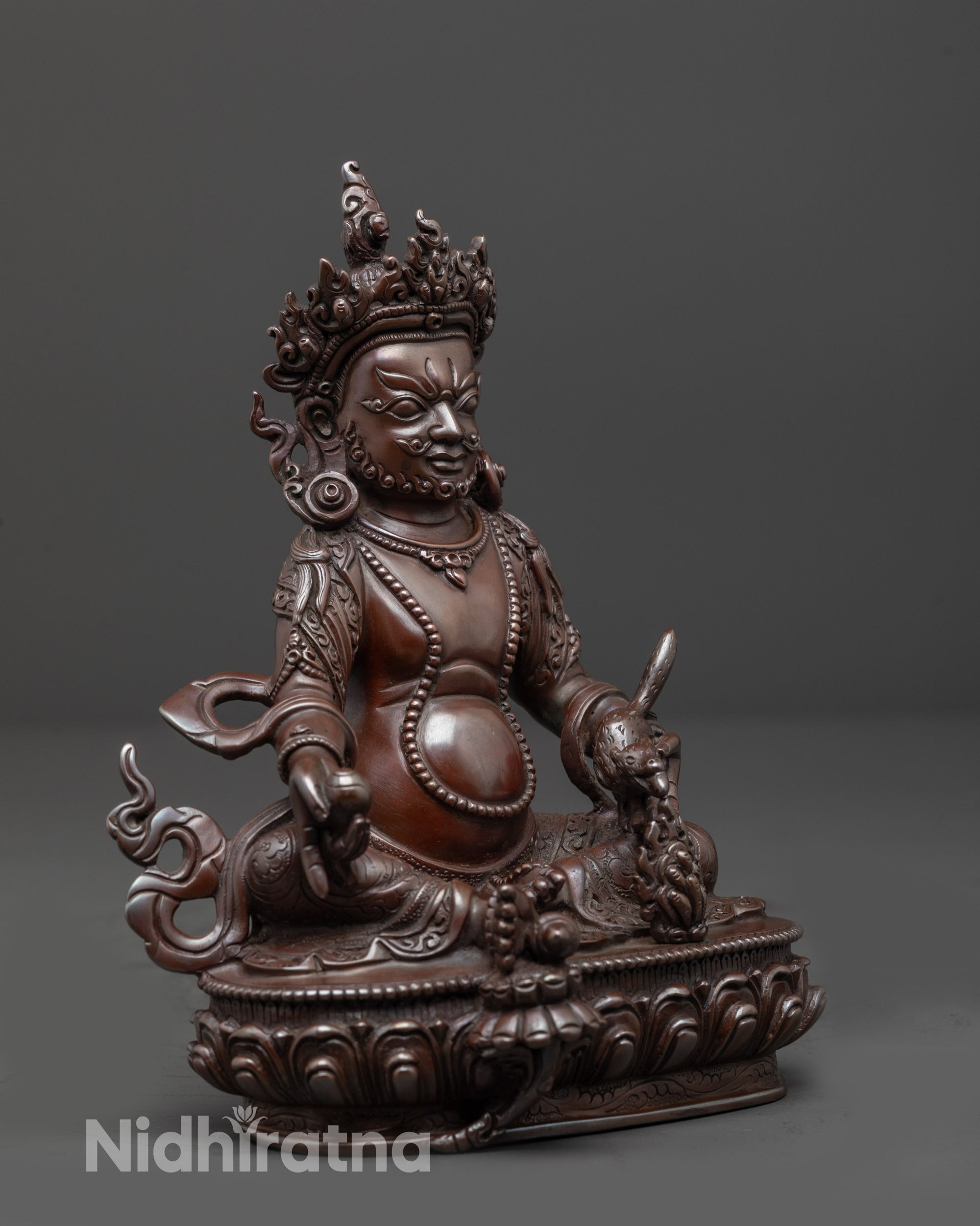 side view of oxidized copper Dzambhala Sculpture on moon disc and lotus seat
