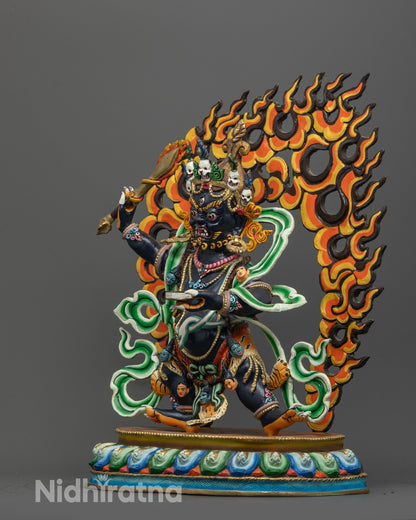 side view of wrathful manjushri copper statue holding sword and prajnaparamita sutra