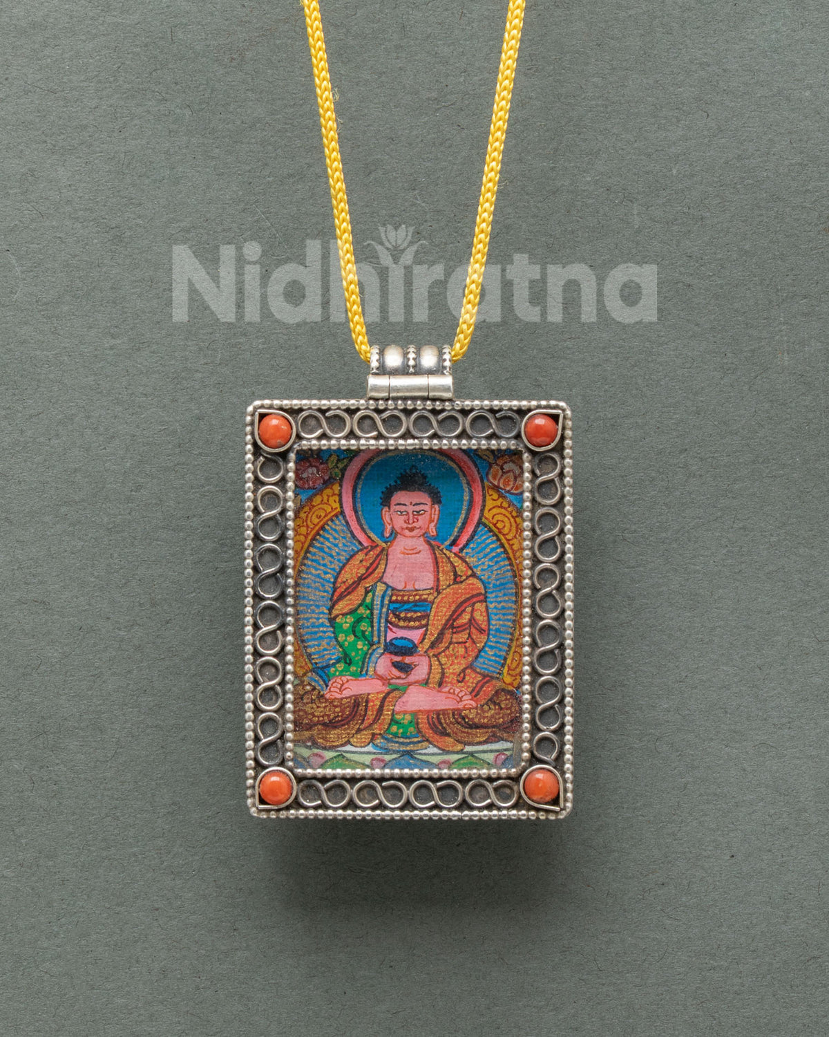 Silver Amitabha Buddha locket featuring a miniature hand-painted Buddhist thangka on cotton canvas with acrylic paints.