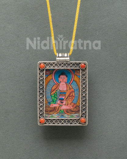Silver Amitabha Buddha locket featuring a miniature hand-painted Buddhist thangka on cotton canvas with acrylic paints.