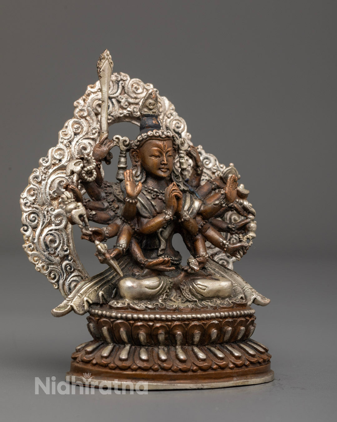 Silver-plated Chundi statue seated on a double lotus pedestal
