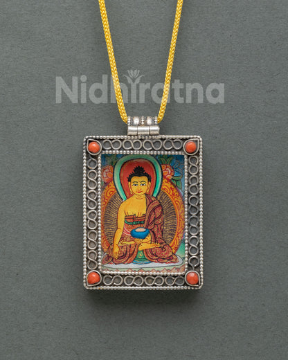 Silver Shakyamuni Buddha locket featuring an authentic miniature hand-painted Buddha thangka on cotton canvas with acrylic paints.