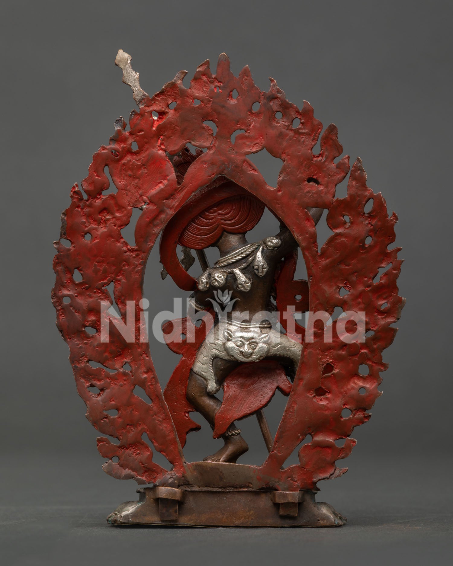 Simha Mukha statue with oxidized silver plated copper finish.