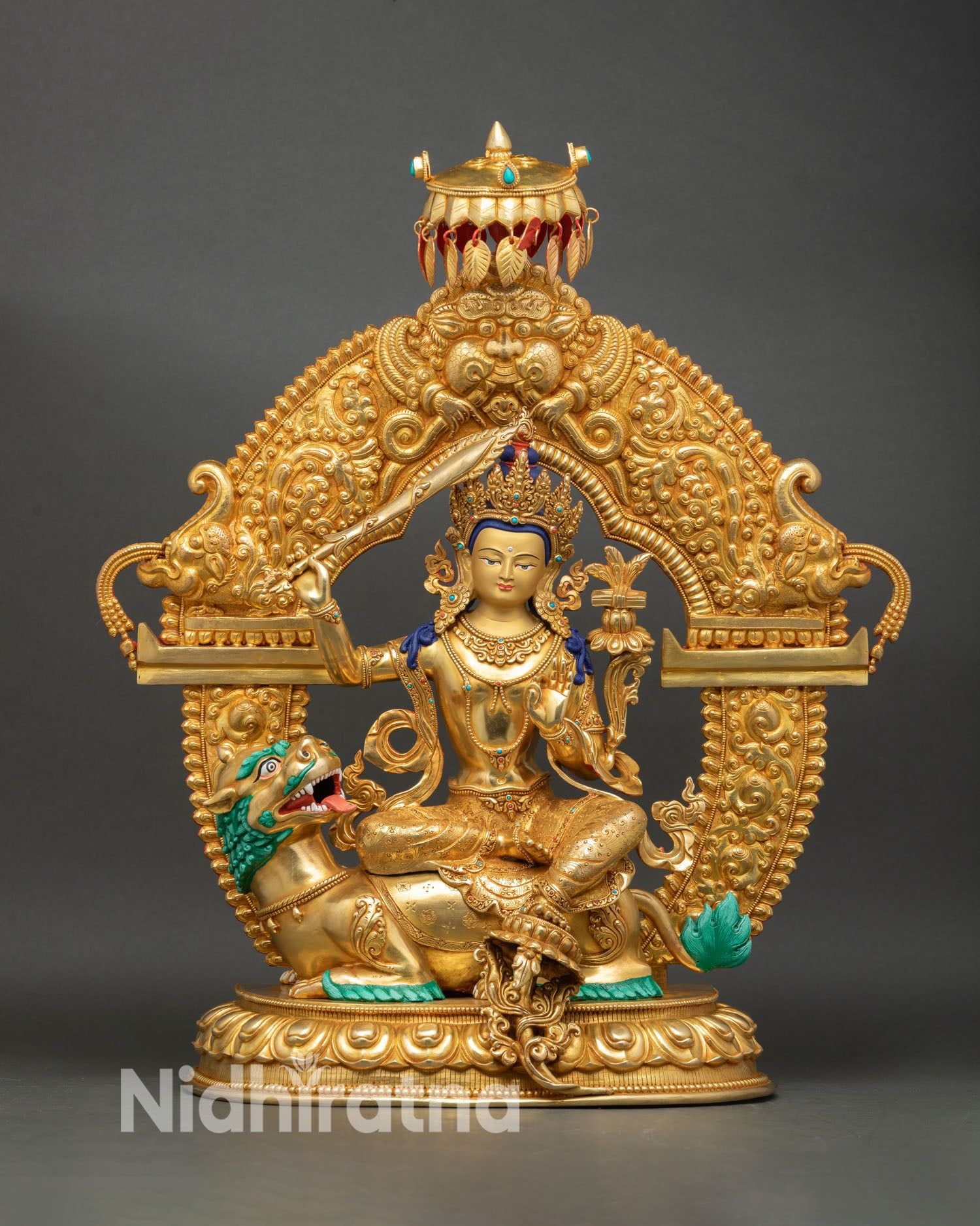 Simhada Manjushree Bodhisattva statue front view lion riding wisdom deity handmade Nepal copper gold