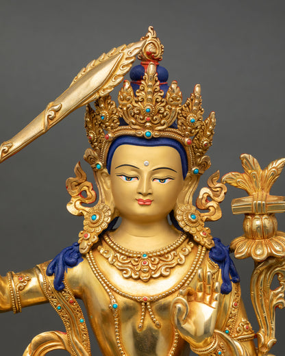 Simhada Manjushri close up gold painted face detail lost wax copper Buddhist sculpture Nepal