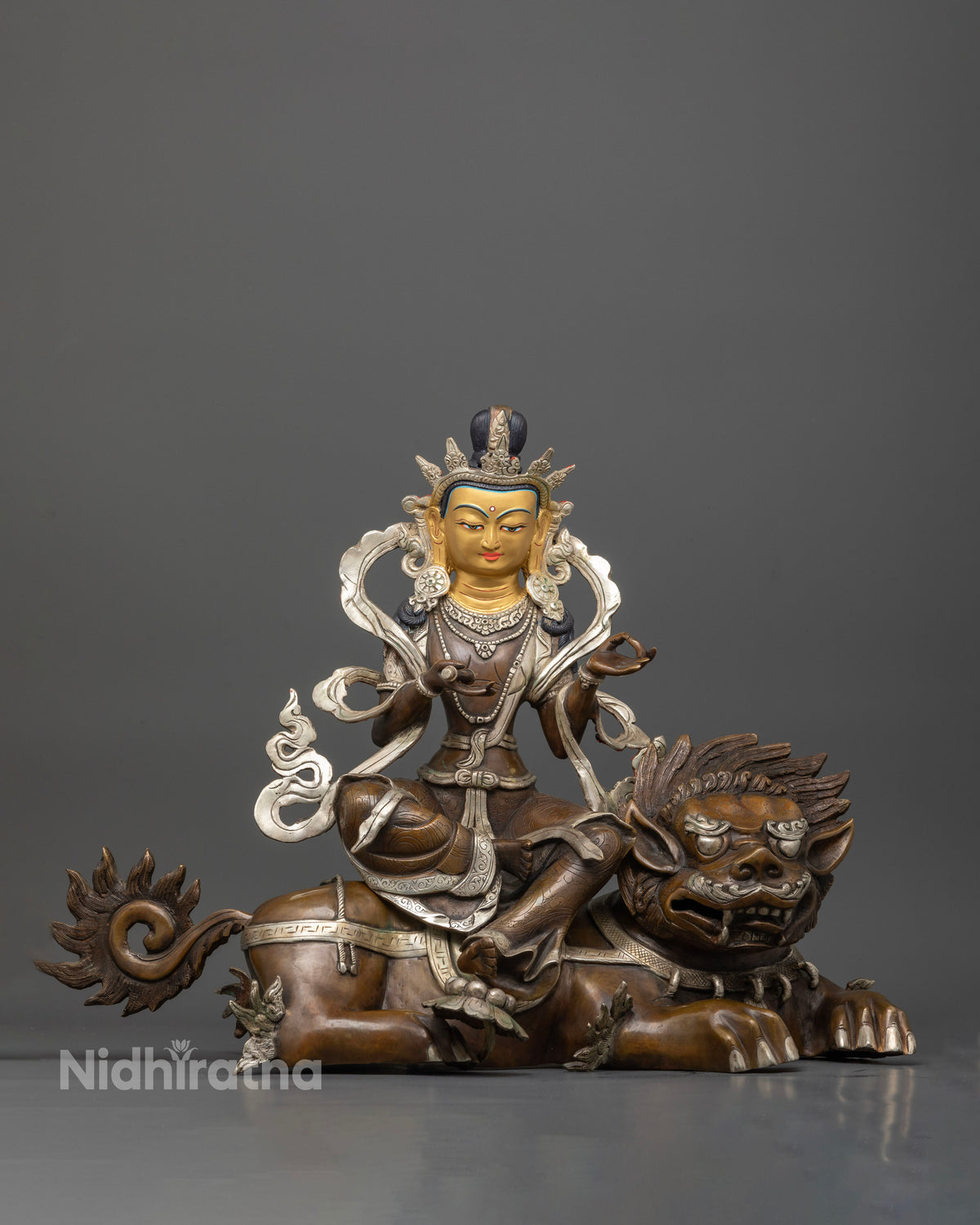 Simhanada chenrezig statue handcrafted by newari artist from patan nepal with silver plated finish.