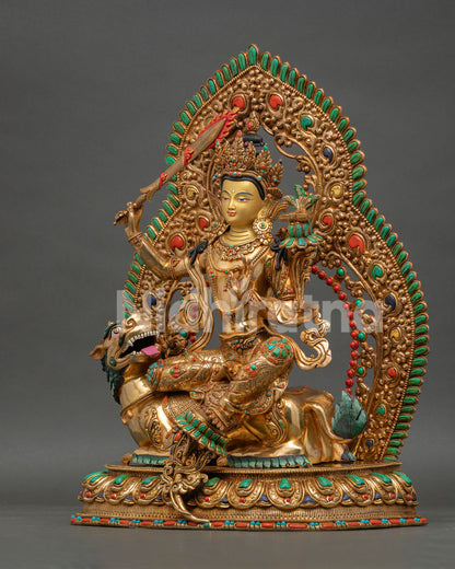 Simhanada Manjushri sculpture with gemstone embellishments and traditional Himalayan Buddhist artistry