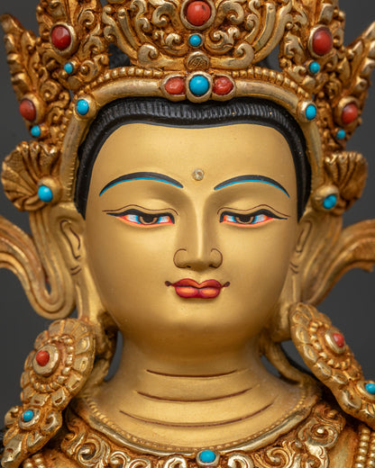 Simhanada Manjushri statue detailed face close-up, serene gold-painted expression