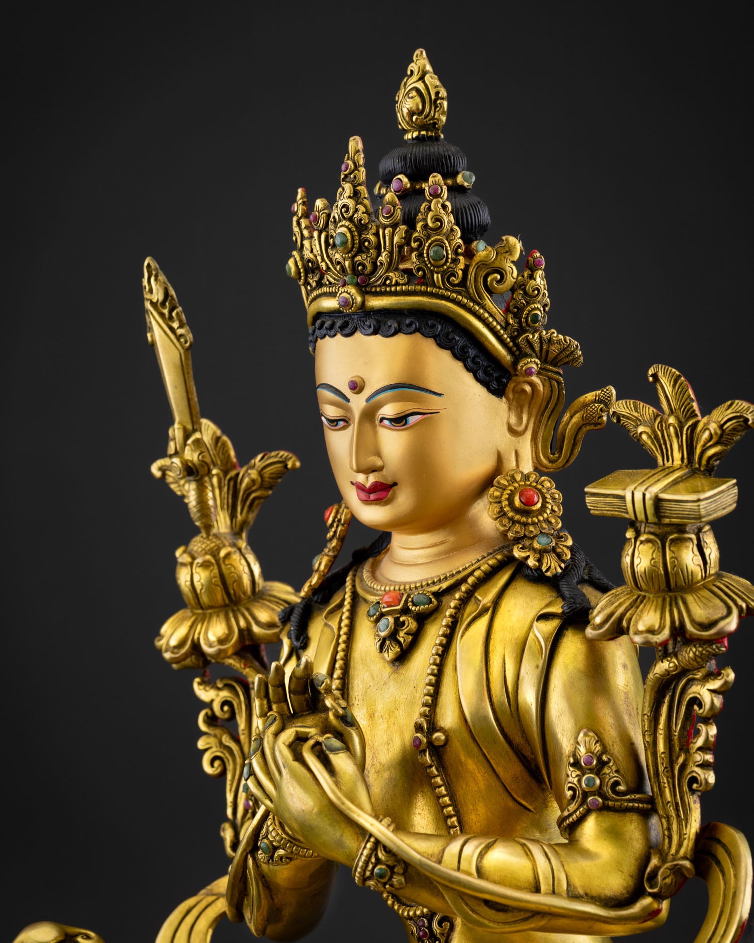 Simhanada Manjushri statue for altar display showing complete Himalayan Buddhist craftsmanship copper structure intricate ornaments and spiritual wisdom deity symbolism