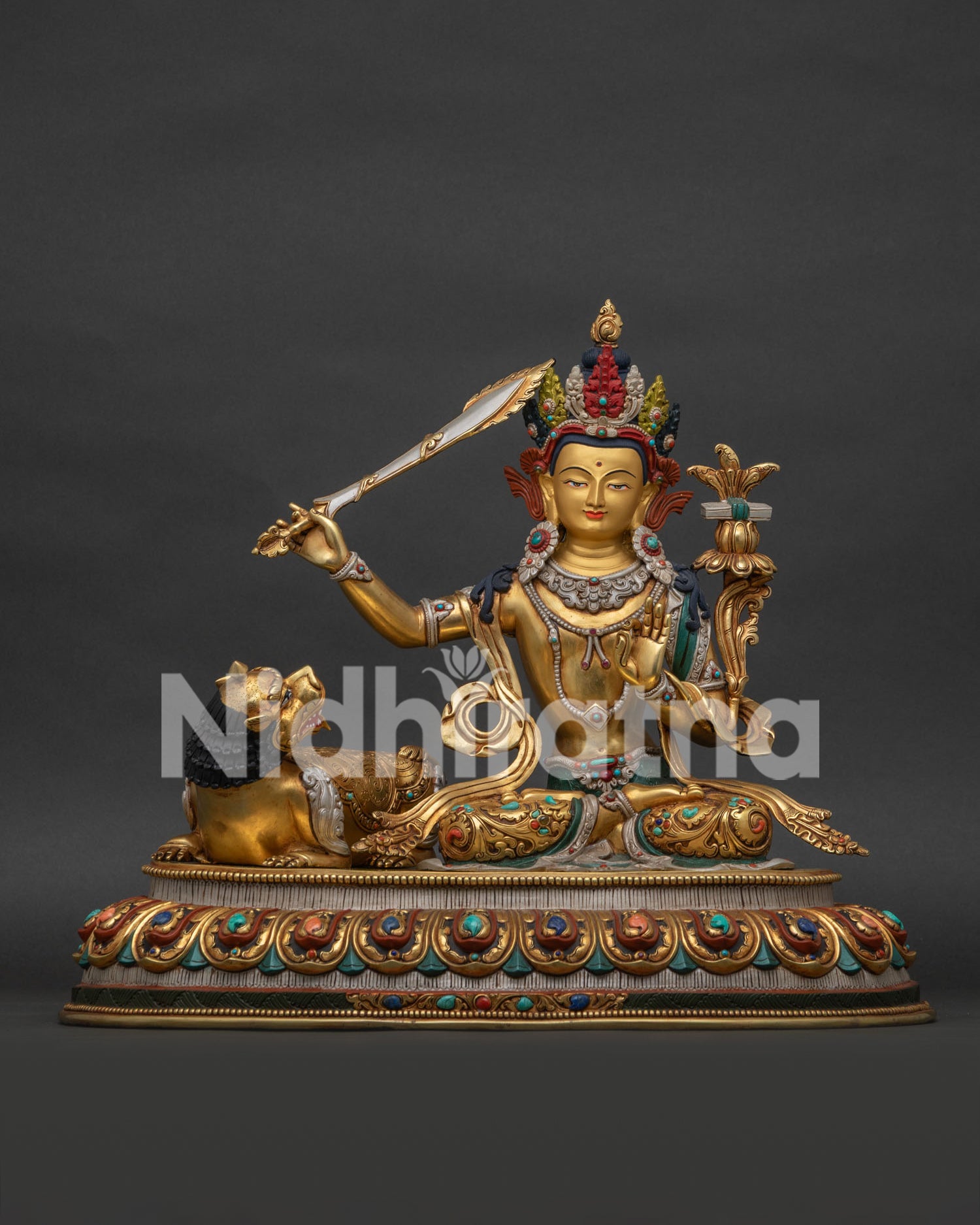Simhanada Manjushri statue front view - gold gilded wisdom Bodhisattva with snow lion