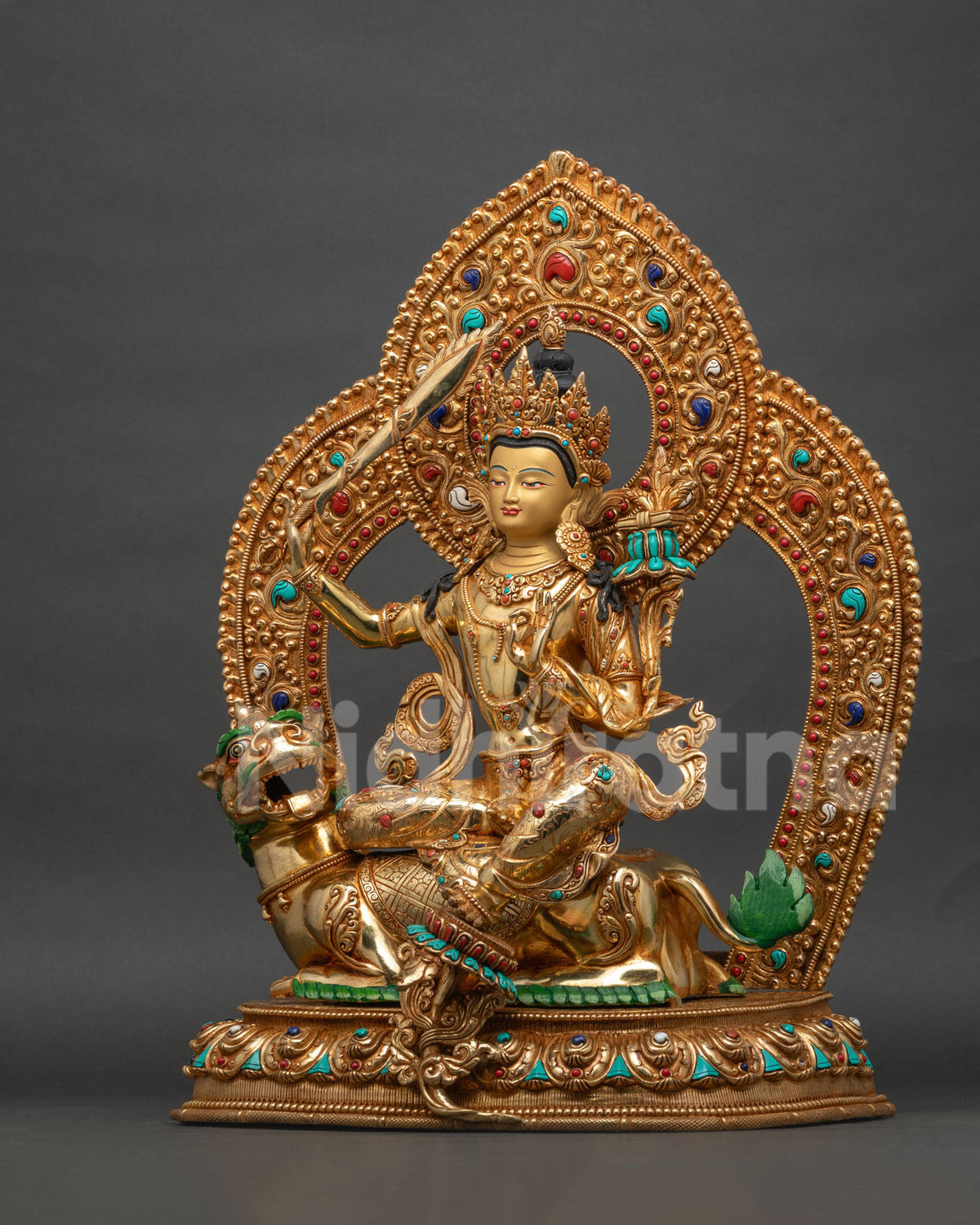 Simhanada Manjushri statue left side view, utpala flower and scripture detail