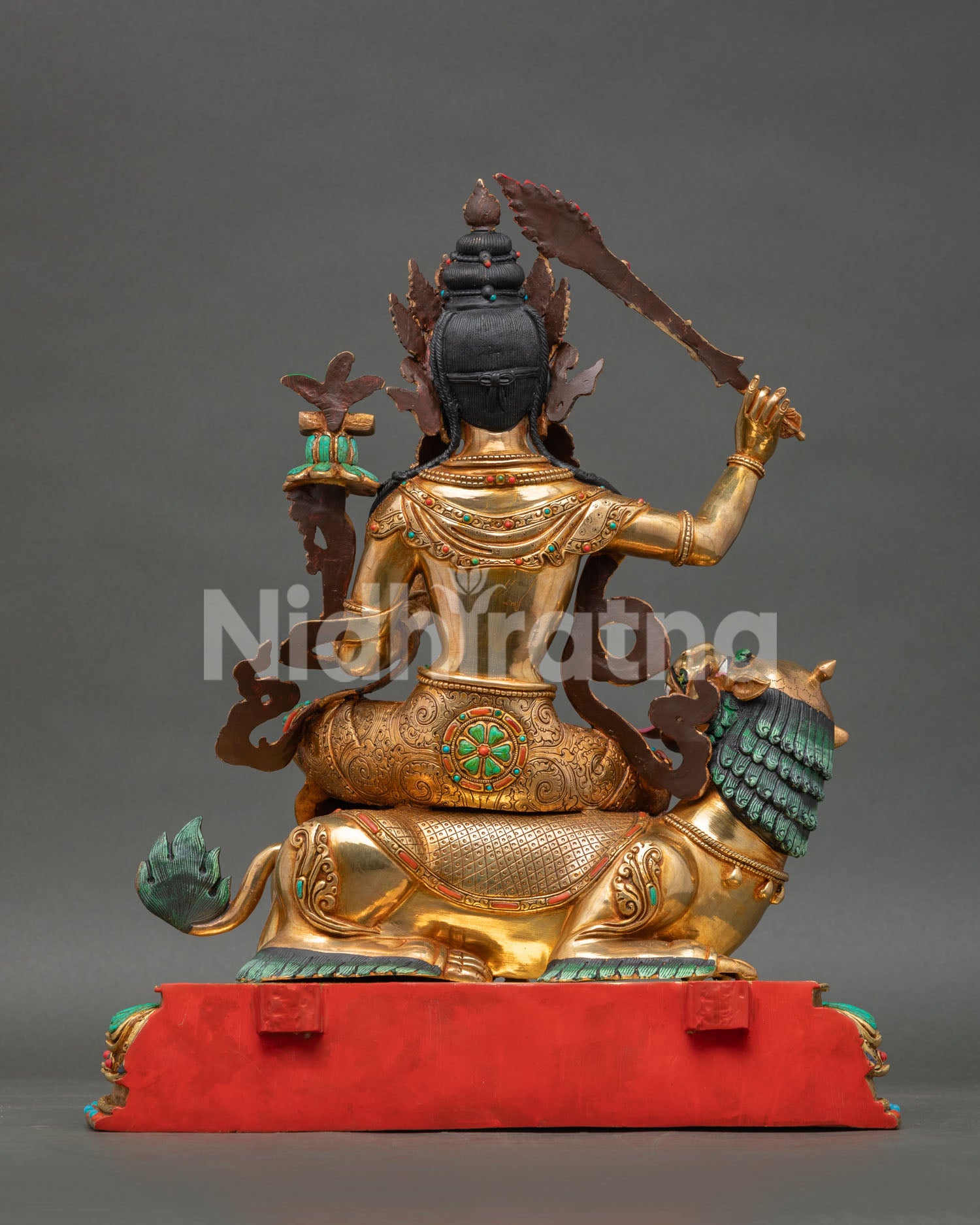 Simhanada Manjushri statue revealing detailed carvings and handcrafted Nepalese copper metalwork