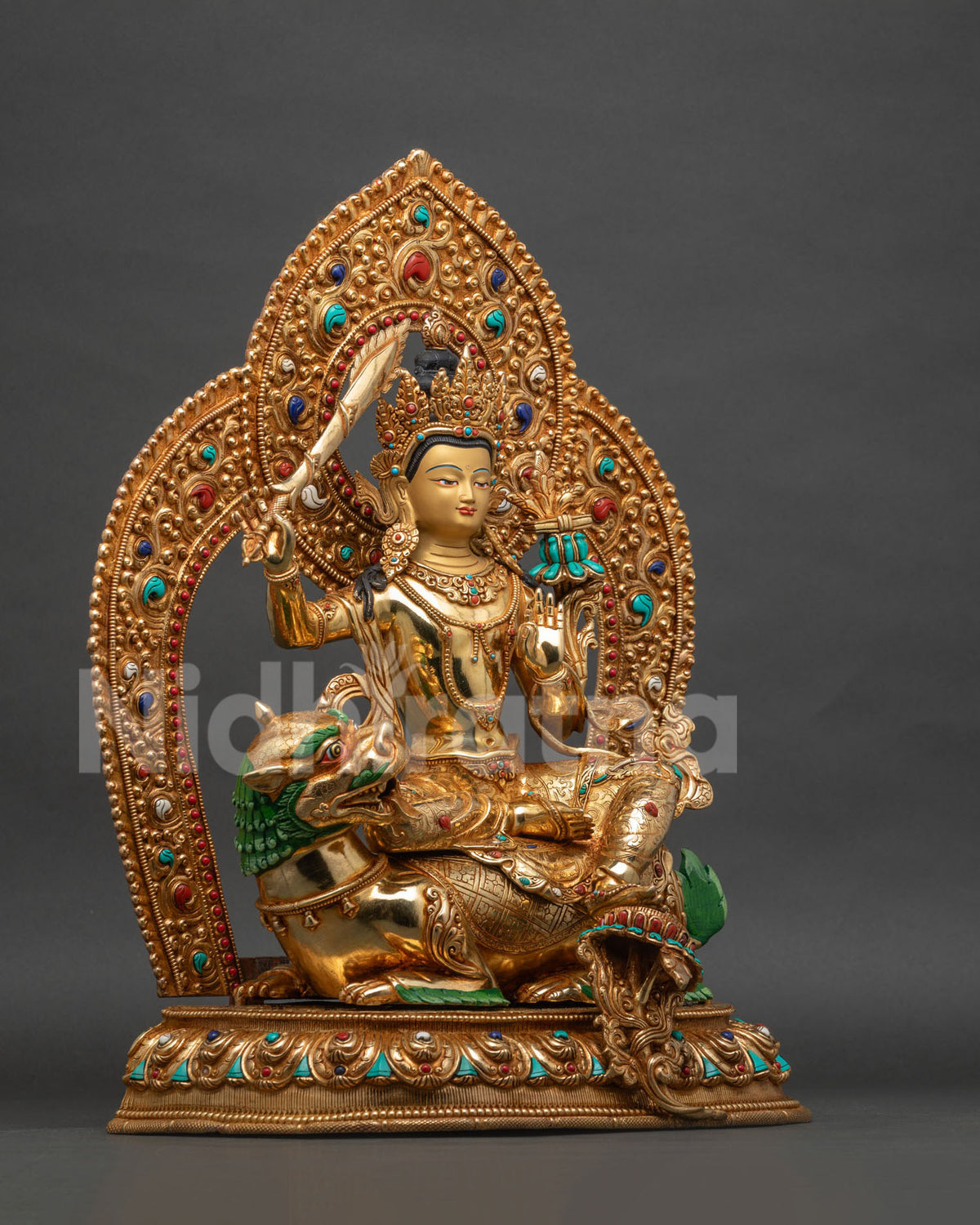 Simhanada Manjushri statue right side view, sword of wisdom hand detail