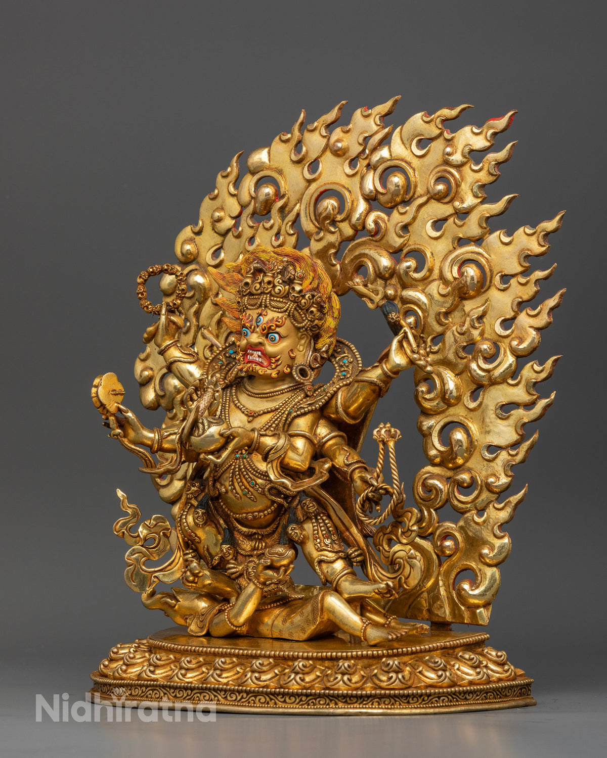 six-armed-mahakala-standing-on-subdued-figure-atop-detailed-lotus-pedestal