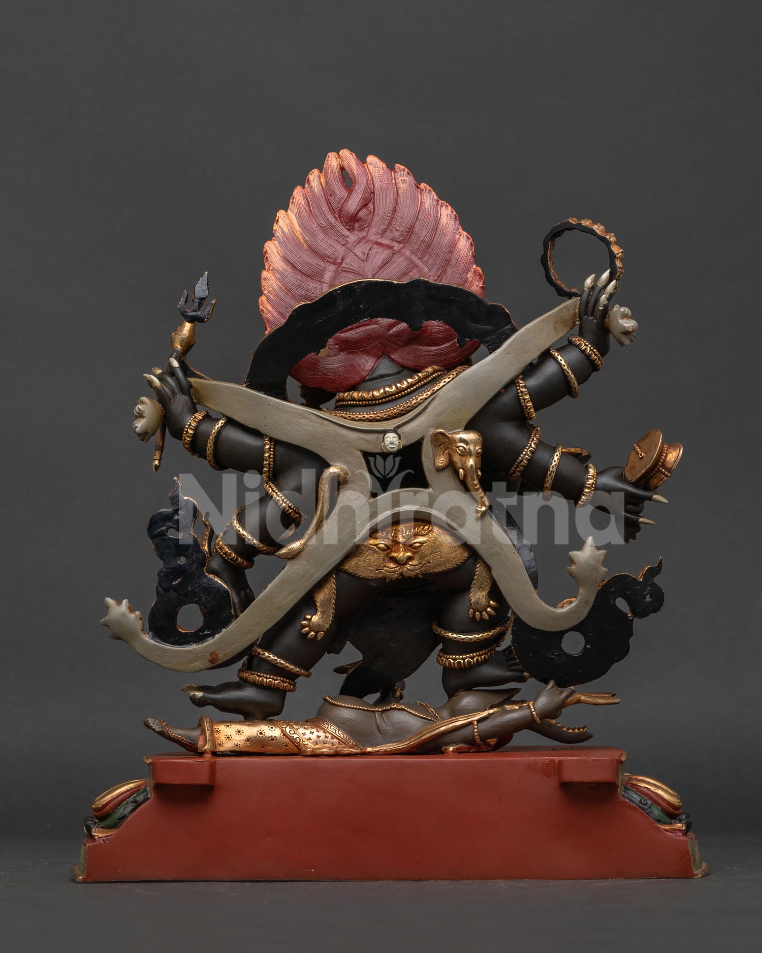 Six-armed Mahakala statue back view, revealing the hand-carved robe design and finely crafted traditional Nepalese artistic details.