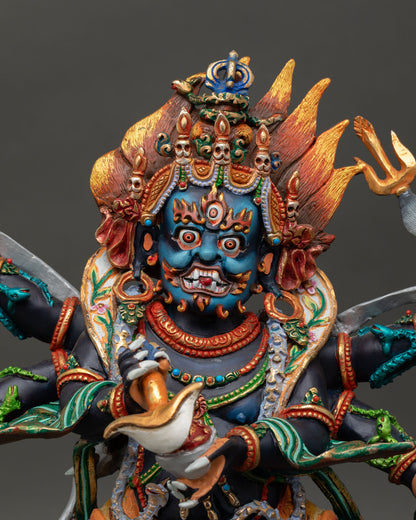 Six Armed Mahakala statue close up view wrathful face third eye five skull diadem sacred Buddhist art