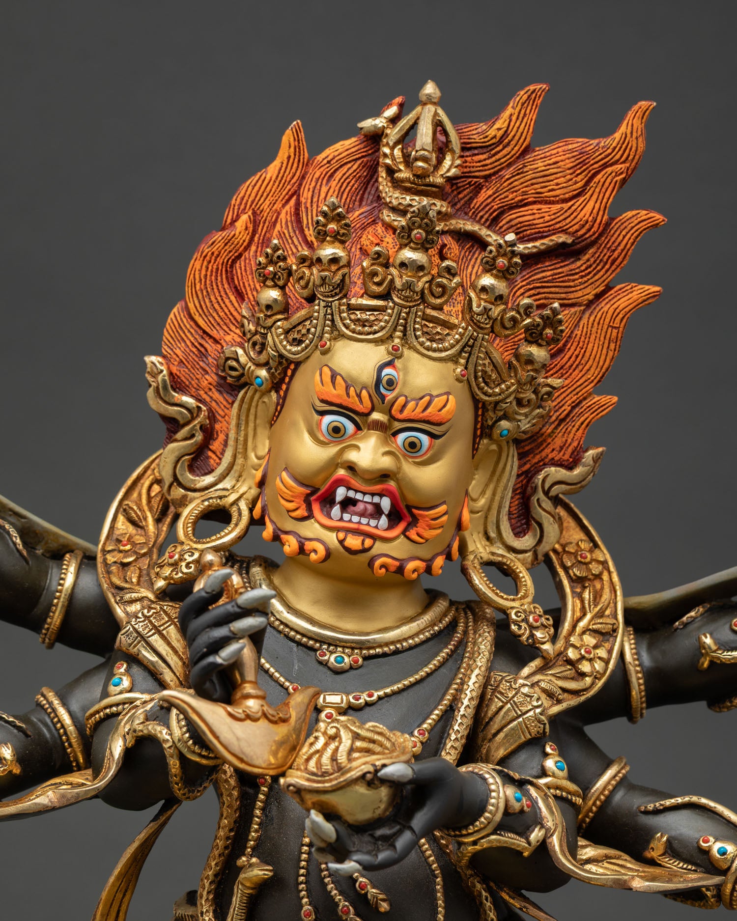 Six Armed Mahakala Statue Close Up with Gold Gilding and Sacred Ornaments Nepal