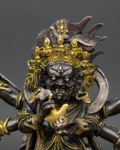 Six-armed Mahakala statue close-up, oxidized copper Buddhist protector deity Nepal