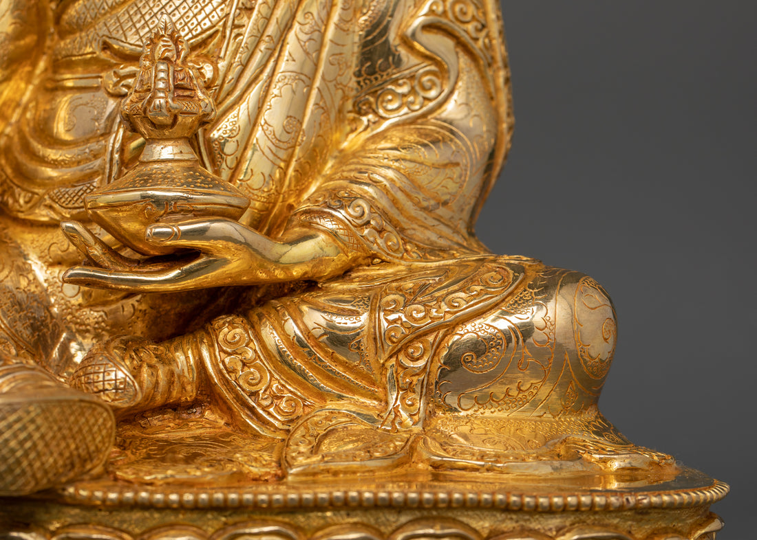 left hand of guru Padmasambhava holding skull base with vase