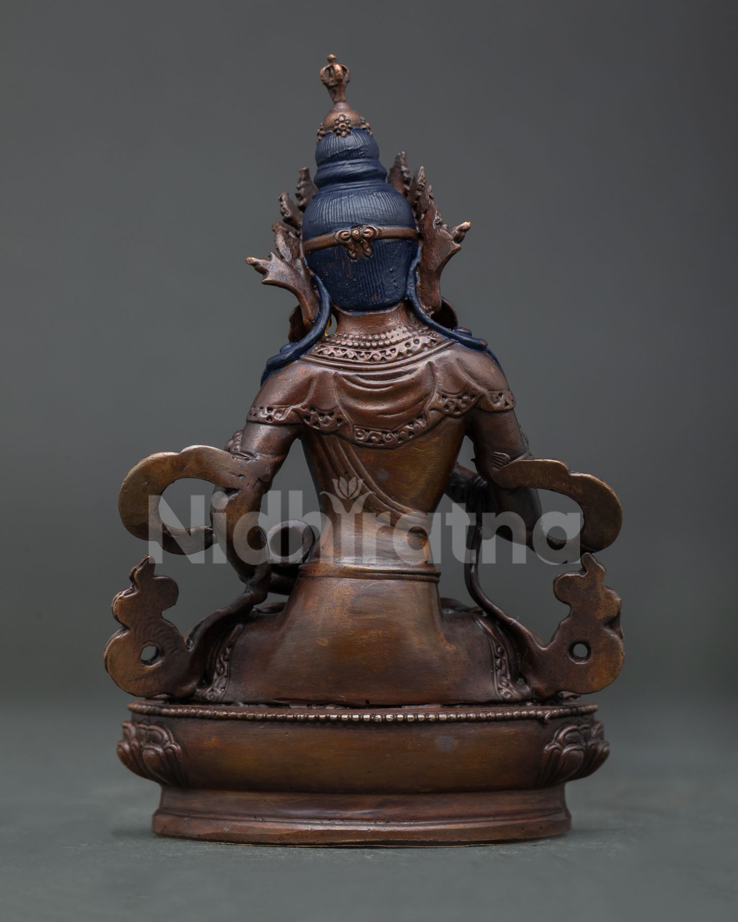 Small Vajrasattva Buddha sculpture for meditation space featuring lotus pedestal oxidized copper finish and sacred Buddhist symbolism