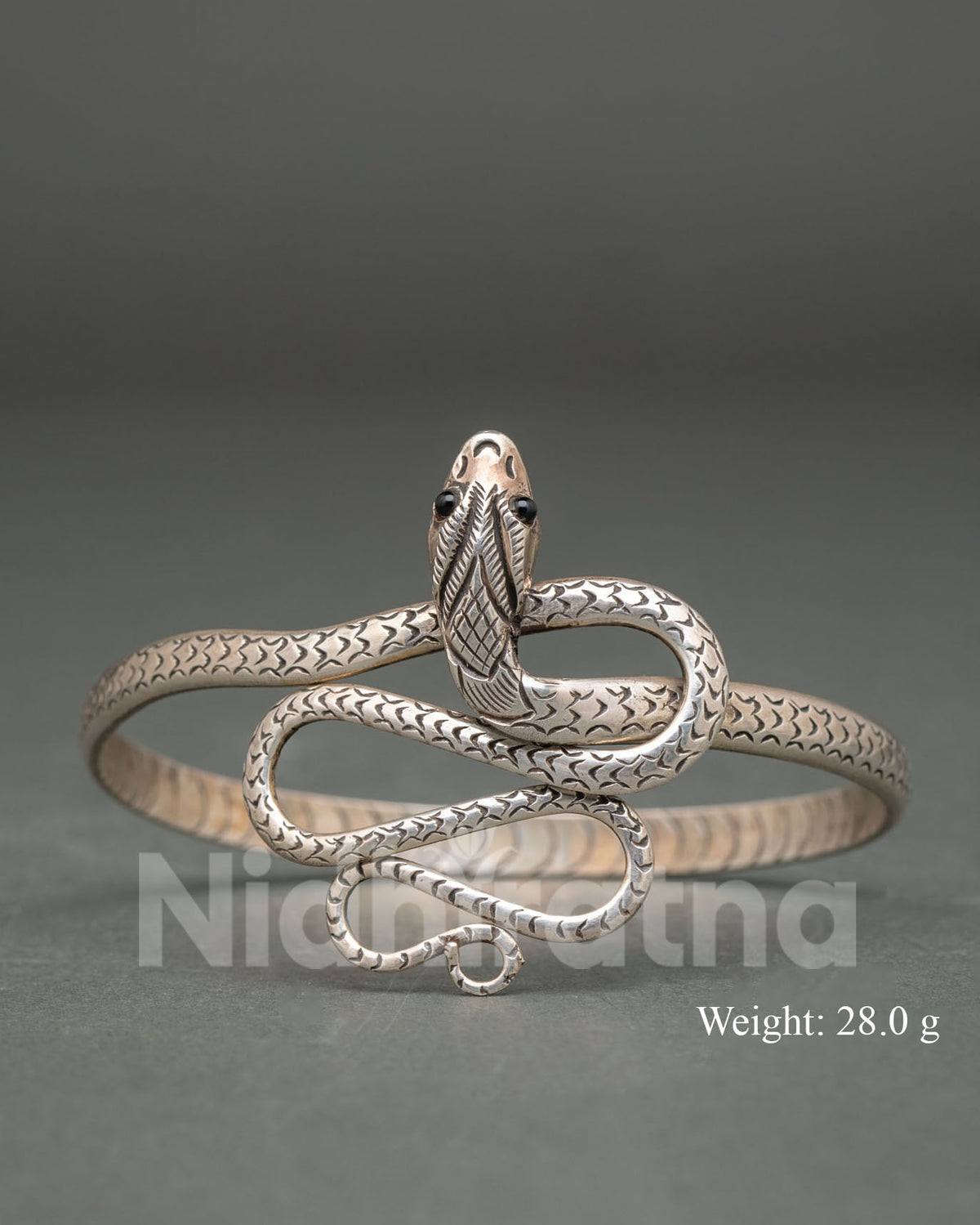 Snake design bracelet handcrafted by Newari artisans from Patan Nepal in pure silver