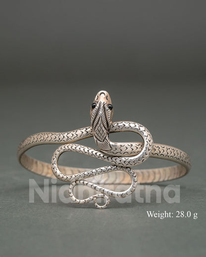 Snake design bracelet handcrafted by Newari artisans from Patan Nepal in pure silver