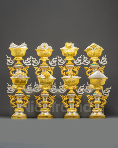 stamangala set front view with Eight Auspicious Symbols on ornate pedestals, gold and silver-plated copper