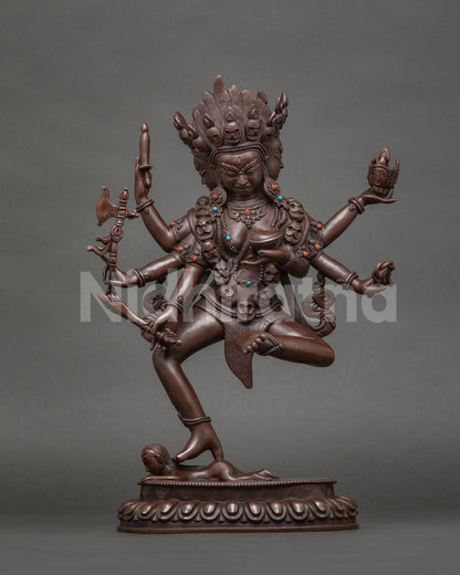Standing Bhrkuti Tara statue, wrathful six-armed form with skull garland, oxidized copper