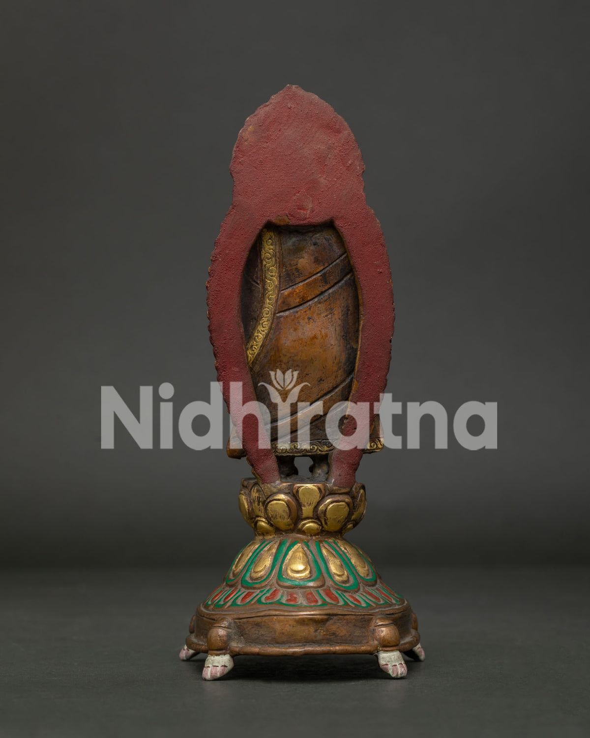 Standing Buddha statue back view handcrafted copper Buddhist sculpture from Patan Nepal.