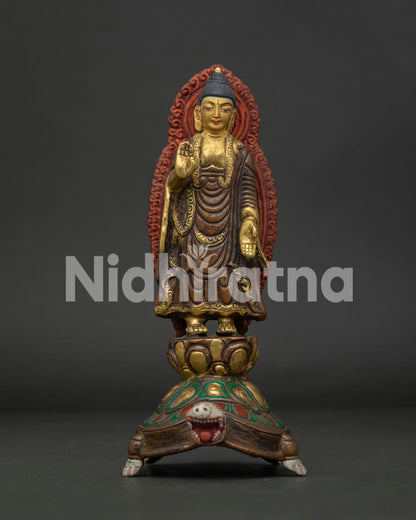 Standing Buddha statue front view oxidized gold gilded copper Nepalese sculpture.