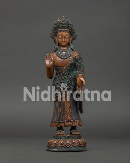 standing dipankara buddha statue handcrafted in nepal with oxidized copper finish