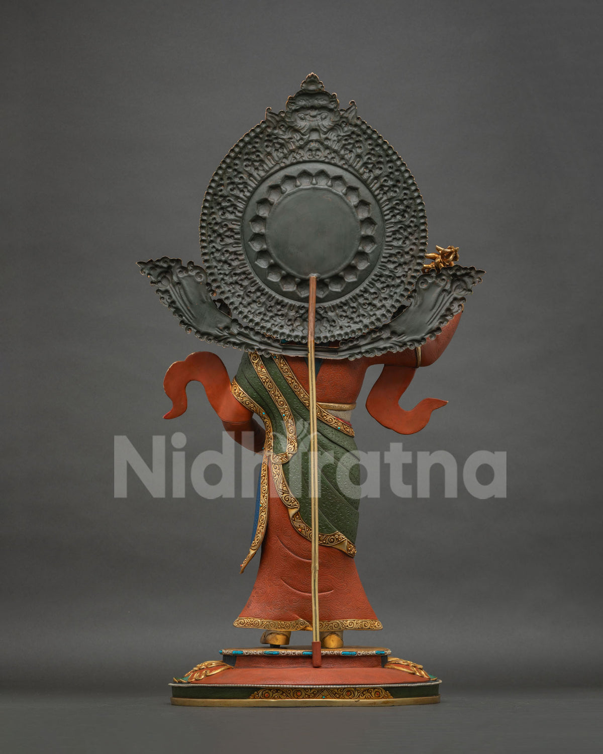 Standing Guru Rinpoche Padmasambhava statue, back view showing halo and staff