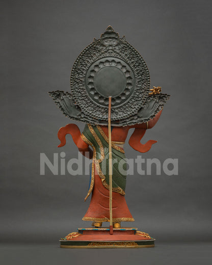 Standing Guru Rinpoche Padmasambhava statue, back view showing halo and staff