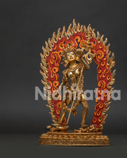 Standing Vajrayogini Statue on Lotus Pedestal Above Wrathful Human Figures.