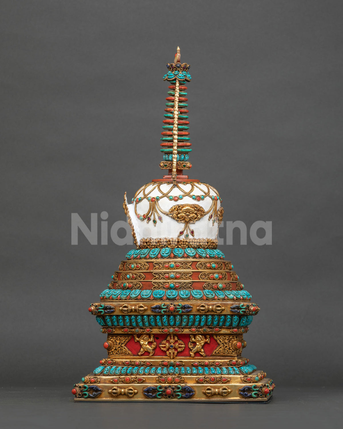 Stupa base with lion guardians, vajra motifs and gold-gilded repoussé on hand-painted copper, Nepal