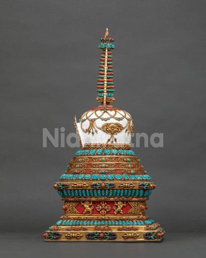 Stupa base with lion guardians, vajra motifs and gold-gilded repoussé on hand-painted copper, Nepal