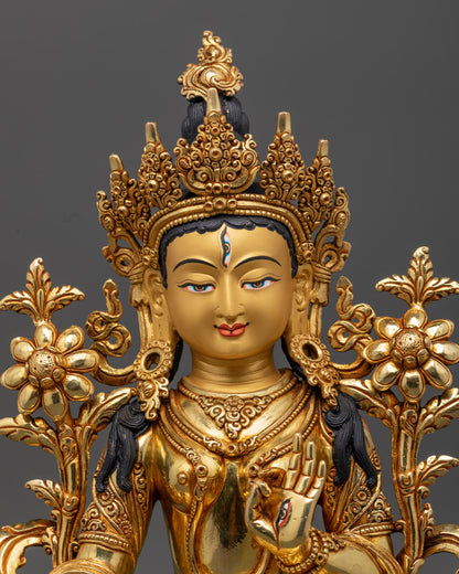 the White Tara Statue's serene face and intricate gold-plated details, showcasing fine Himalayan craftsmanship and sacred spiritual elegance
