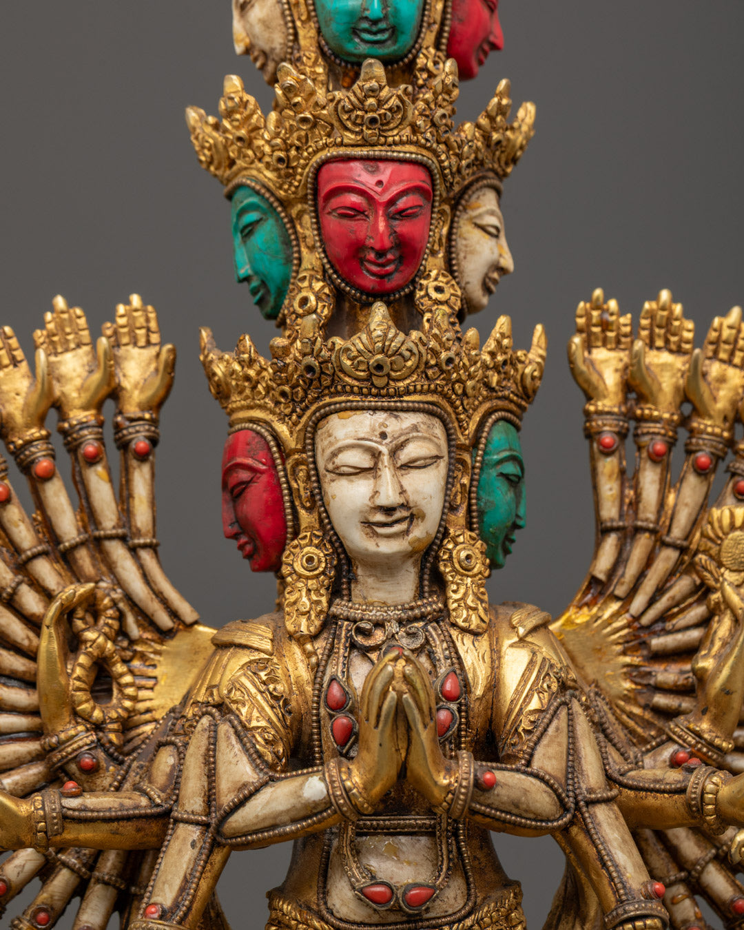 the hand-carved 1000 Arm Chenrezig Statue showcasing gold fire gilded finish and semi-precious stone adornments.