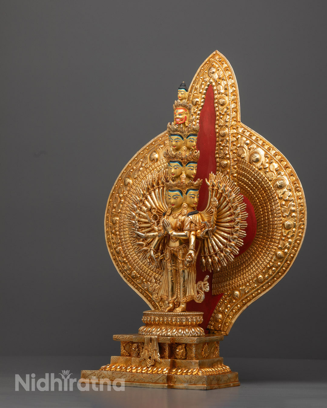 the wish-fulfilling jewel held by central hands of Thousand-Armed Chenrezig statue