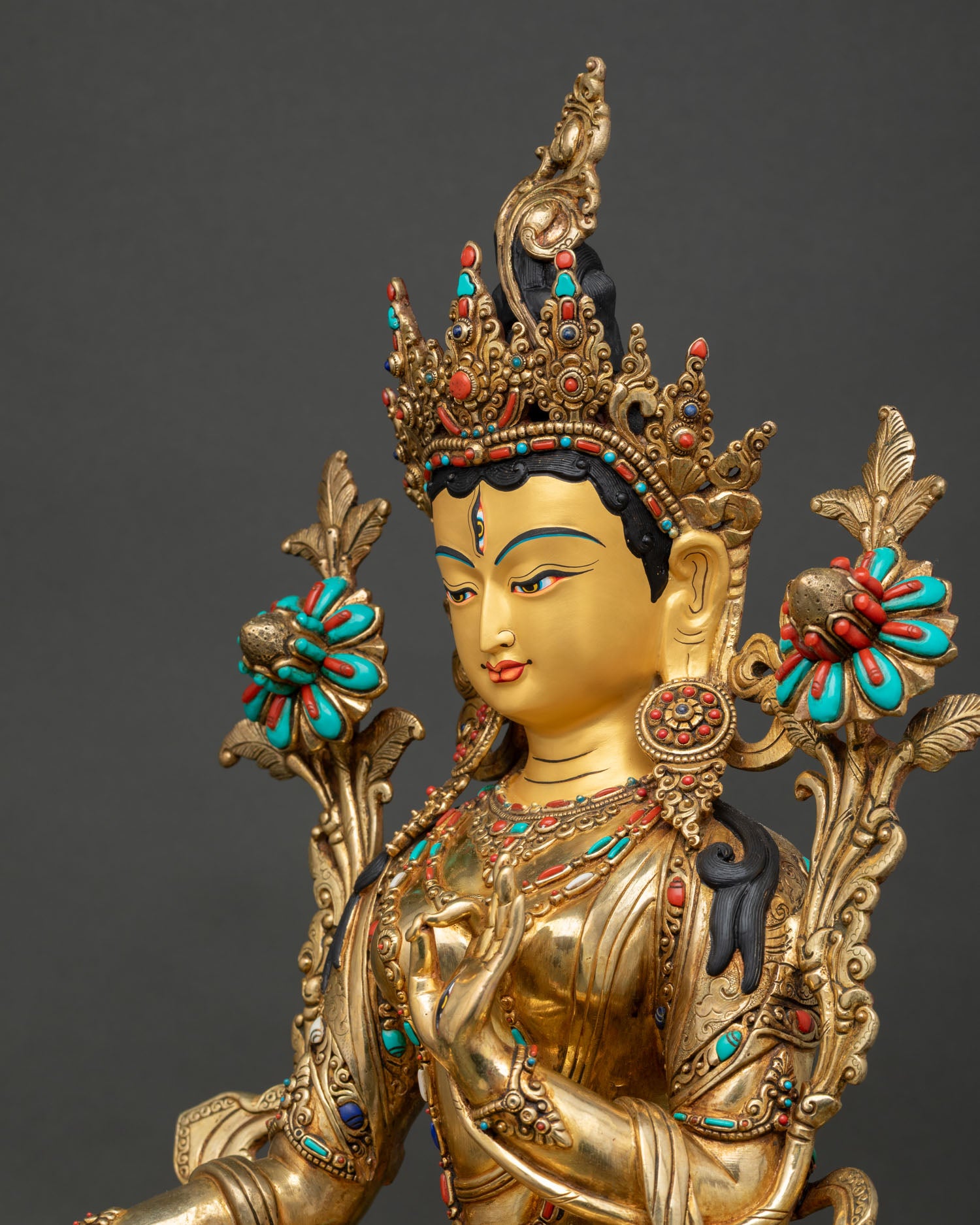 Three-quarter right view of White Tara statue with ornate crown and sacred ornaments